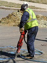 Man operating drill
